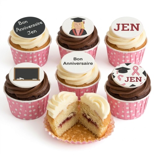 Assortment of vanilla and chocolate cupcakes with graduation and custom message toppers.