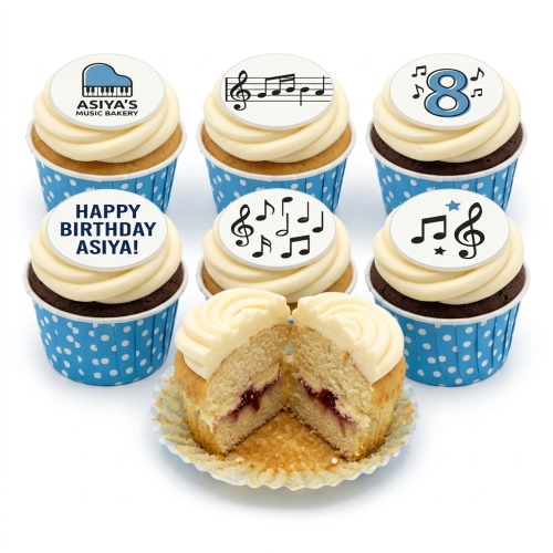 Cupcakes with white frosting, blue polka dot cases, and music-themed edible toppers including piano, musical notes, and a custom age '8'.