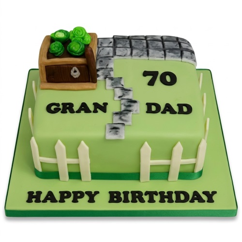 Square green gardening theme birthday cake with a wooden planter, green vegetables, stone path, and white picket fence.