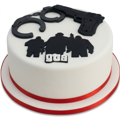 Round white GTA theme birthday cake with black character silhouettes, handcuffs, and a gun decorations, with a red ribbon base.