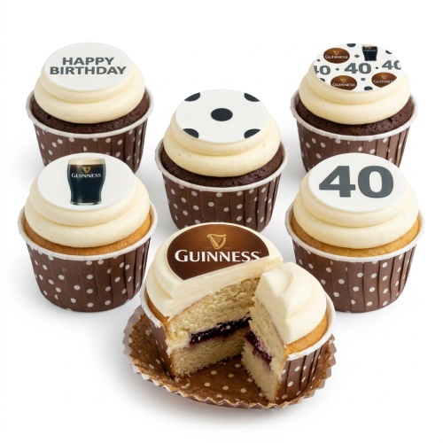 A selection of Guinness themed birthday cupcakes with white frosting, brown polka dot cases, and edible toppers including Guinness logos, a pint of Guinness, a football, 'Happy Birthday' text, and a custom age '40' topper.