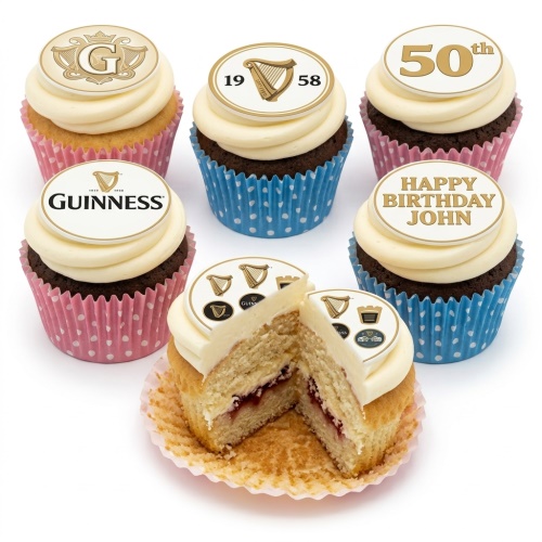 Guinness theme birthday cupcakes with white frosting, gold branded toppers, and polka dot wrappers, some with custom age and message.