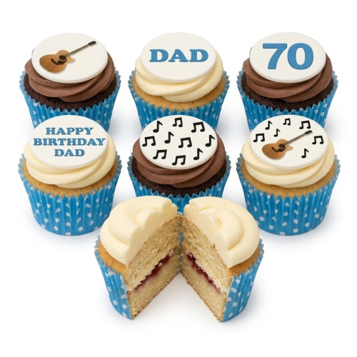 Birthday cupcakes with guitar and music note toppers, vanilla and chocolate frosting, blue polka dot wrappers.