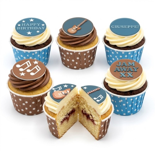 Music themed birthday cupcakes with guitar and musical note toppers, blue and brown polka dot cases.