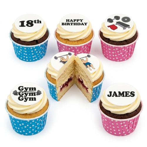 Gym theme birthday cupcakes with weightlifting and fitness equipment toppers, in blue and pink cases.