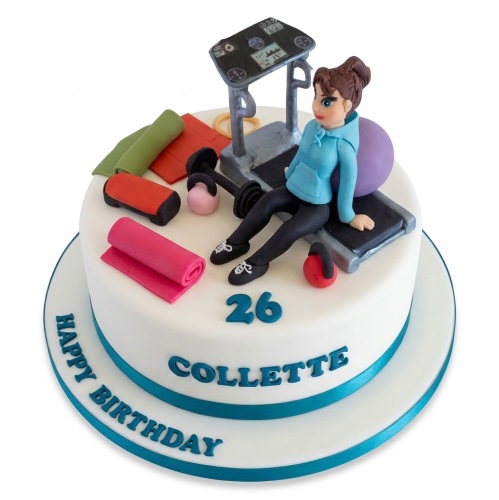 White round birthday cake with female figurine, treadmill, yoga mat, dumbbells, and custom age.
