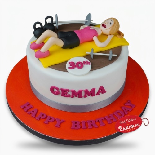 White fondant gym theme birthday cake with female figure, weights, and custom age topper.
