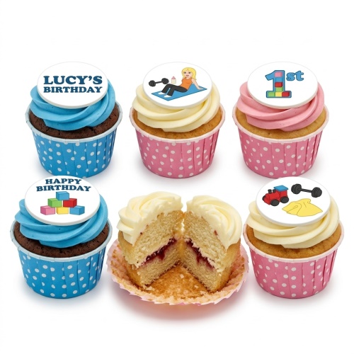 White square birthday cupcakes with a female fondant figure on a yoga mat, gym accessories, baby figure, and toy train.