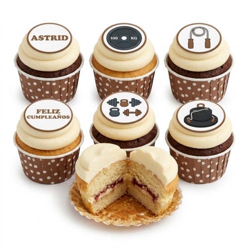 Set of fitness and gym theme cupcakes with edible toppers featuring weights, skipping rope, and measuring tape, on brown polka dot wrappers.