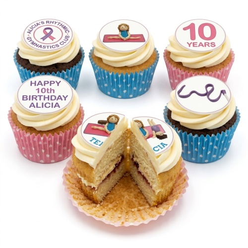 Gymnastics themed cupcakes with white frosting, blue and pink cases, and edible toppers.