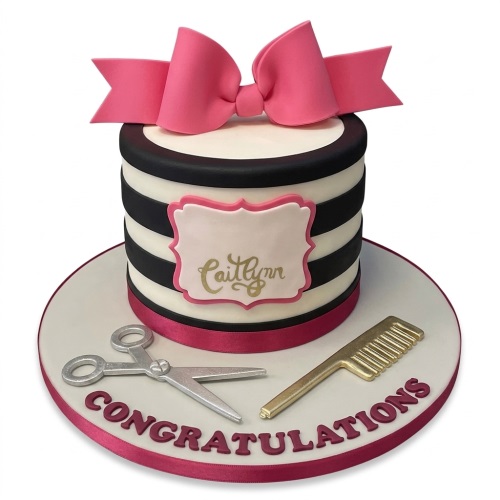 Single-tier round cake with black and white stripes, pink bow, silver scissors, gold comb, and personalised message.