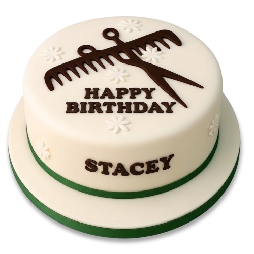 Round cream birthday cake with dark brown edible scissors, comb, and white flowers, with a green ribbon.