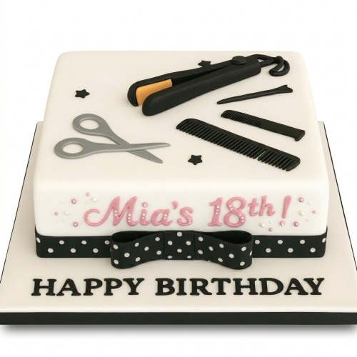 Square white fondant cake with edible hair straighteners, scissors, combs, and a black and white polka dot ribbon, with a custom age and message.