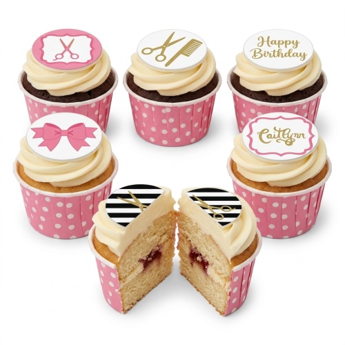 Cupcakes with pink and white polka dot wrappers, topped with white icing and edible toppers featuring gold scissors, combs, and a pink bow.
