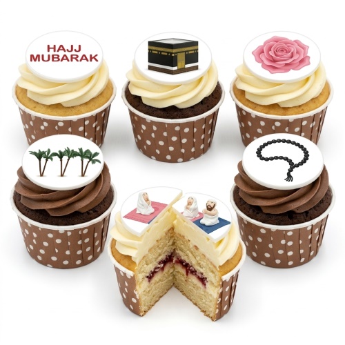 A selection of Hajj Mubarak themed cupcakes with Kaaba, prayer beads, palm trees, and 'Hajj Mubarak' edible toppers.