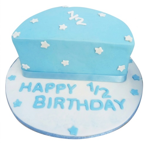 Blue half birthday cake for baby boy with white and blue stars and 'Happy 1/2 Birthday' message.