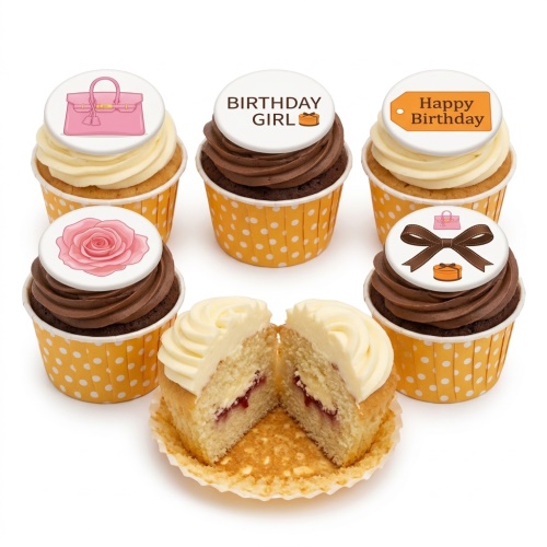 Assorted cupcakes with designer handbag, rose, and birthday girl toppers.