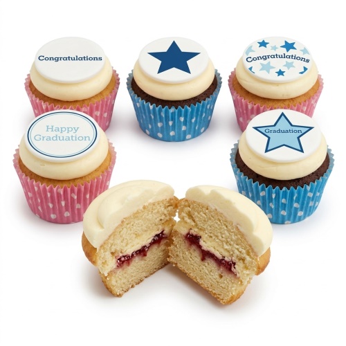 Graduation cupcakes with white frosting, blue star and 'Congratulations' toppers, in pink and blue wrappers.