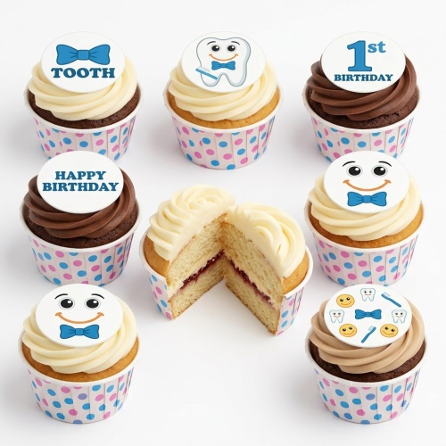 Vanilla and chocolate cupcakes with white frosting and tooth-themed toppers, including a '1st Birthday' message.
