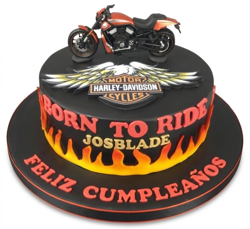 Black Harley-Davidson motorcycle birthday cake with orange flames and custom name.