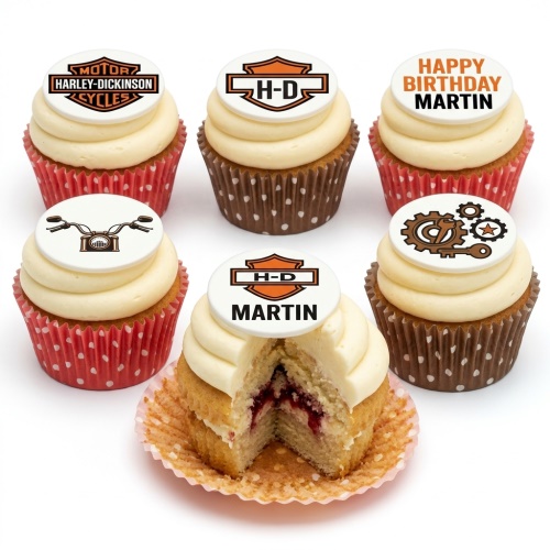 Harley Davidson themed birthday cupcakes with motorcycle logos and designs, some with a red fruit filling.