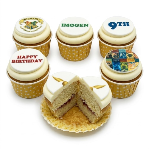 Harry Potter themed cupcakes with Hogwarts crest, book covers, Golden Snitch, and custom age topper.