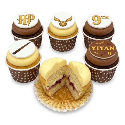 Harry Potter themed cupcakes with HP logo, Golden Snitch, and magic wand toppers.