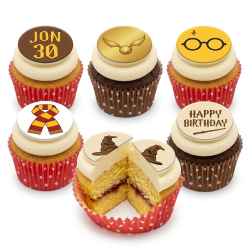 Harry Potter themed cupcakes with edible toppers including Golden Snitch, glasses, scarf, Sorting Hat, and wand.