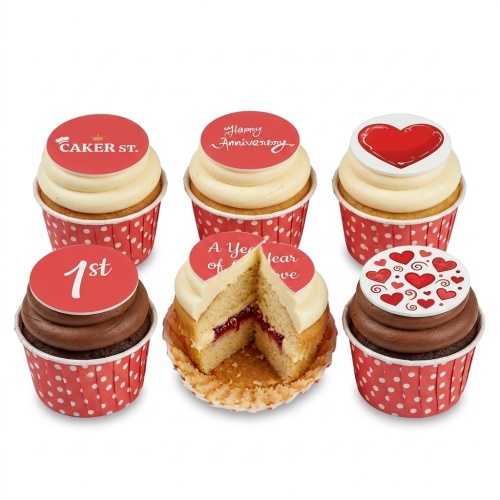 A set of six anniversary cupcakes with red and white heart toppers and custom messages.