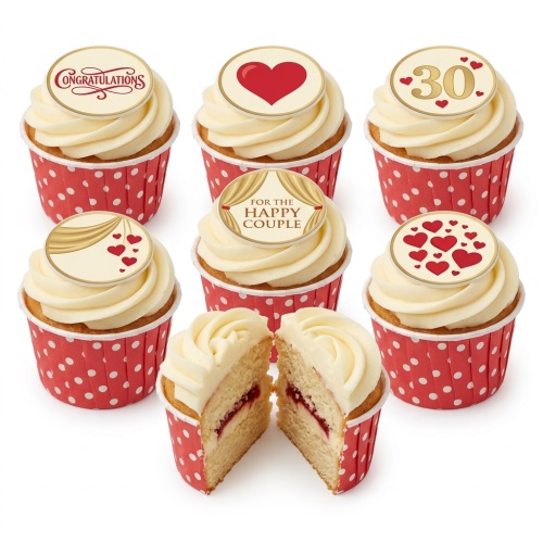 Vanilla cupcakes with cream frosting, red polka dot cases, and edible toppers featuring hearts, 'Congratulations', and 'For the Happy Couple'.