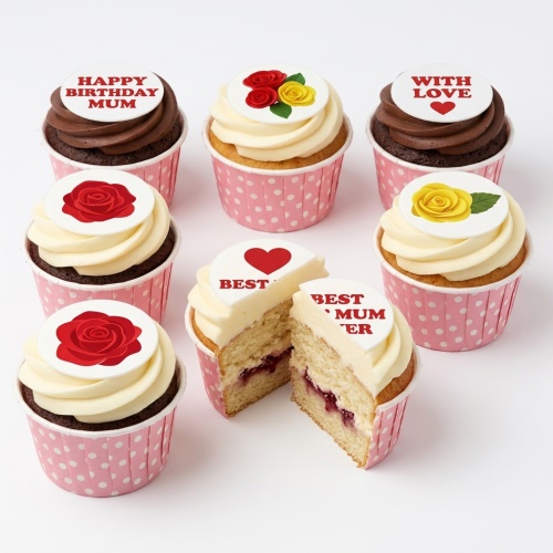 A selection of chocolate and vanilla cupcakes with white frosting, pink polka dot cases, and edible toppers featuring red and yellow roses, a red heart, and messages like 'Happy Birthday Mum' and 'Best Mum Ever'.