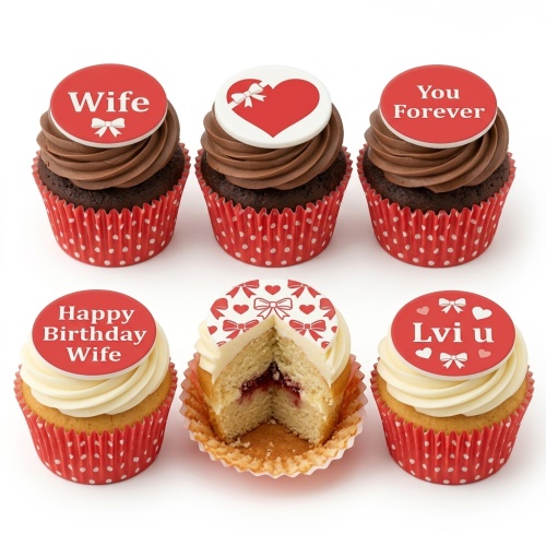 Set of six cupcakes with red and white polka dot wrappers, topped with red and white edible toppers featuring hearts, bows, and affectionate messages.