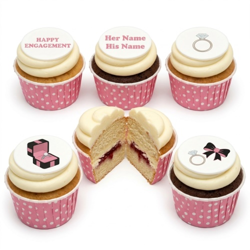 Engagement cupcakes with ring and ring box toppers, some with custom text on white icing.