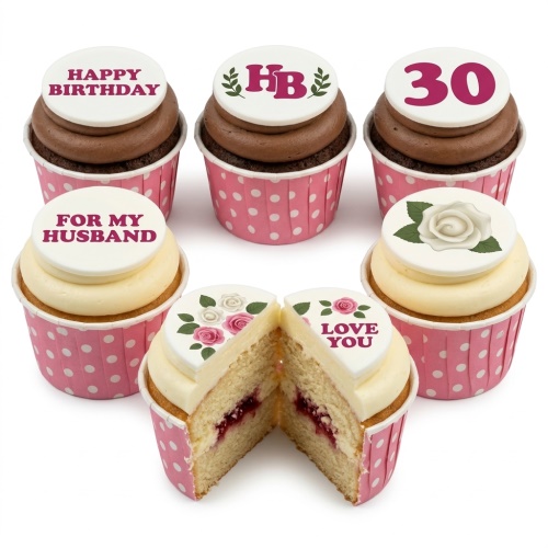 Pink polka dot cupcakes with floral rose toppers, custom age, and personalised messages.