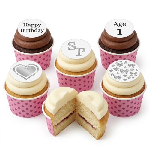 Six cupcakes in pink polka dot wrappers with custom birthday toppers including age, initials, and messages.