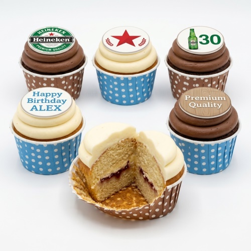 Assortment of beer theme birthday cupcakes with custom toppers, including a Heineken logo, beer bottle, and 'Premium Quality' barrel.