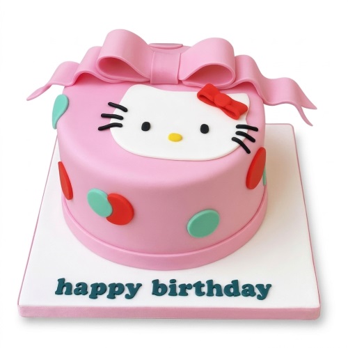 Pink Hello Kitty birthday cake with a large bow and colourful polka dots on a white board with 'happy birthday' message.