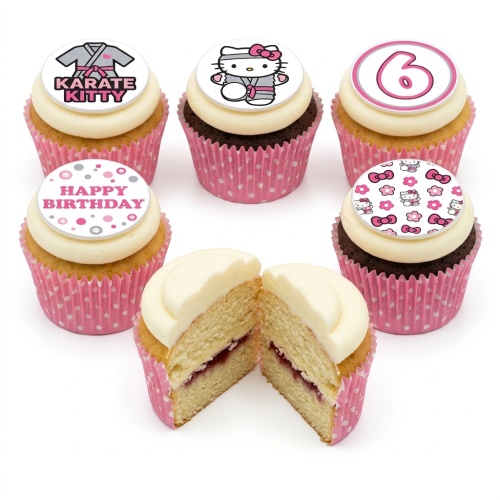 Set of Hello Kitty themed birthday cupcakes with pink polka dot wrappers, including 'Karate Kitty', 'Happy Birthday', and a number 6 topper.