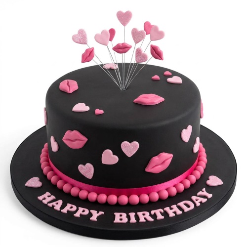 Black birthday cake with pink lips and glitter hearts, topped with a 'Happy Birthday' message.