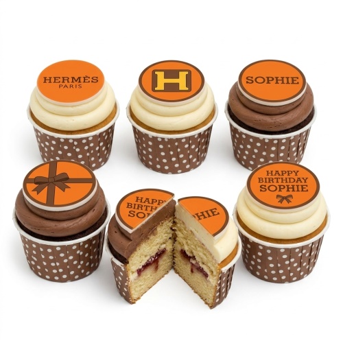 Hermès inspired cupcakes with orange and brown toppers, some personalised for a birthday celebration.
