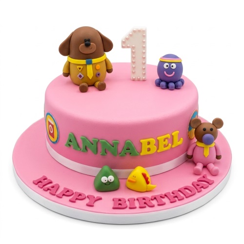 Pink Hey Duggee birthday cake with fondant characters, custom name, and age topper.