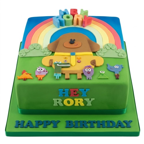 Two-tier square Hey Duggee birthday cake with Duggee, Squirrels, and a rainbow decoration.