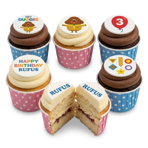 Hey Duggee cupcakes with character toppers, a custom age balloon, and a birthday message.