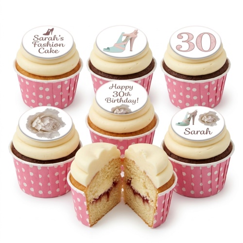 Vanilla and chocolate cupcakes with high heel and floral edible toppers in pink polka dot wrappers.