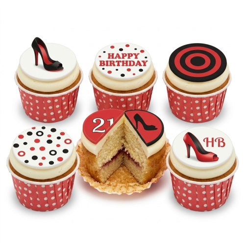 Six cupcakes with red and black high heel shoe toppers and polka dot designs, one cut to show jam filling.