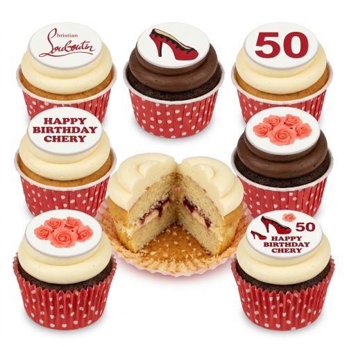Selection of vanilla and chocolate cupcakes with red polka dot wrappers, topped with edible high heels, roses, and a custom age '50' topper.
