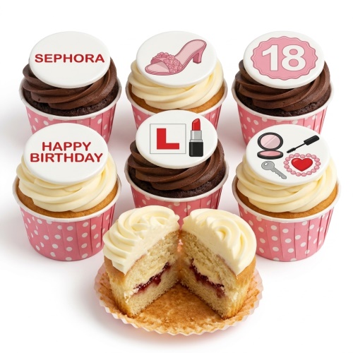 A set of six cupcakes with pink and white polka dot wrappers, topped with various white edible discs featuring a pink high heel, an 'L' plate with lipstick, makeup items, a key and heart, a 'Happy Birthday' message, and a 'Sephora' logo.