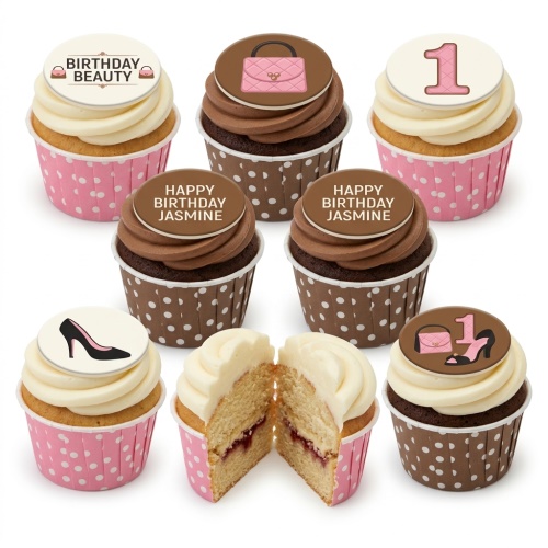 Assortment of vanilla and chocolate cupcakes with fashion-themed toppers: pink handbags, black high heels, and a custom age topper.