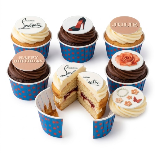 Selection of designer-themed cupcakes with high heel, Christian Louboutin logo, rose, and floral toppers, with custom Happy Birthday and name messages.
