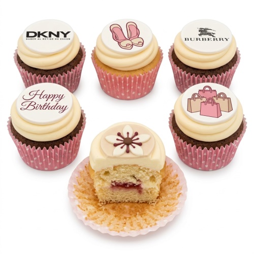 Assortment of fashion-themed birthday cupcakes with designer logos, shopping bags, ballet slippers, and a 'Happy Birthday' message.